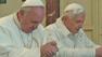 Pope Francis, left, and Pope emeritus Benedict XVI, right, are seen praying side-by-side at chapel Castel Gandolfo on Saturday, March 23, 2013.