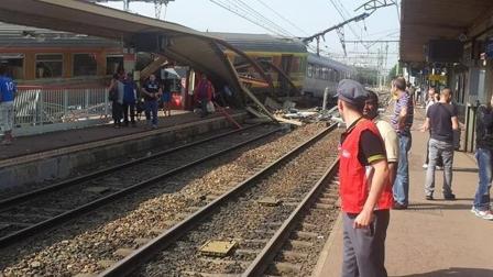 A passenger train derailed at the station at Bretigny-sur-Orge, 12 miles south of Paris, on Friday, July 12, 2013.