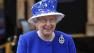Britains Queen Elizabeth II as the Guards march pass outside Buckingham Palace after the Trooping The Colour, at the Horse Guards Parade in London, Saturday, June 15, 2013.