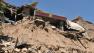 In this July 22, 2013 photo released by Xinhua News Agency, a damaged house stands in rubble following an earthquake that hit Majiagou Village of Minxian County, northwest Chinas Gansu Province.
