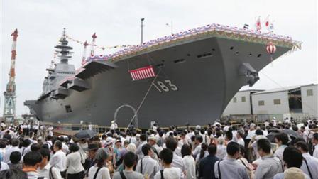 Japans new warship Izumo, which has a flight deck that is nearly 820 feet long, is unveiled in Yokohama, south of Tokyo, Tuesday, Aug. 6, 2013.