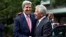 U.S. Secretary of State John Kerry, left, and U.S. Secretary of Defense Chuck Hagel greet each other before attending a wreath laying ceremony at Chidorigafuchi National Cemetery in Tokyo on Thursday, Oct. 3, 2013.