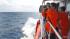 A member of Indonesian National Search and Rescue Agency (BASARNAS) scans the horizon during a search for the missing Malaysia Airlines Boeing 777 conducted on the waters of the Strait of Malacca off Sumatra island, Indonesia, Wednesday, March 12, 2014. A member of Indonesian National Search and Rescue Agency (BASARNAS) scans the horizon during a search for the missing Malaysia Airlines Boeing 777 conducted on the waters of the Strait of Malacca off Sumatra island, Indonesia, Wednesday, March 12, 2014.