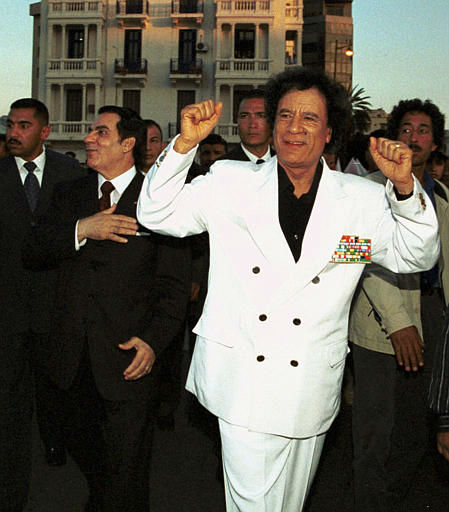 Libyan leader Moammar Gadhafi, right, and...