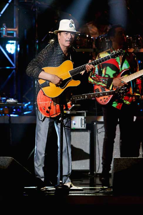 Santana, headed by guitarist Carlos Santana,...