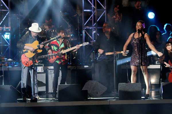 Santana, headed by guitarist Carlos Santana,...