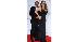 Mariah Carey and husband Nick Cannon pose...
