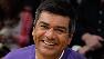 Comedian and actor George Lopez and his daughter Mayan pose for photos during at the Los Angeles Lakers, Cleveland Cavaliers game, Dec. 25, 2009