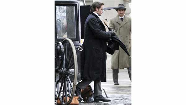 British actor Robert Pattinson, star of Twilight, walks on the set of his new film 'Bel Ami' in Budapest, Hungary, Tuesday, April 6, 2010.