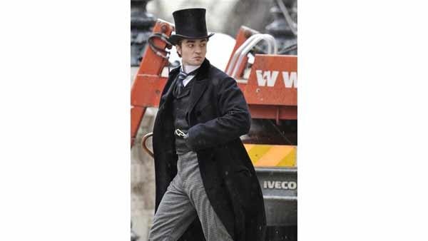 British actor Robert Pattinson, star of Twilight, walks on the set of his new film 'Bel Ami' in Budapest, Hungary, Tuesday, April 6, 2010.