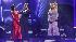 Nicole Scherzinger and partner Derek Hough react...