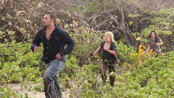 Sawyer (Josh Holloway) leads Claire Littleton (Emilie de Ravin) and Kate Austen (Evangeline Lilly) on a run through the forest.