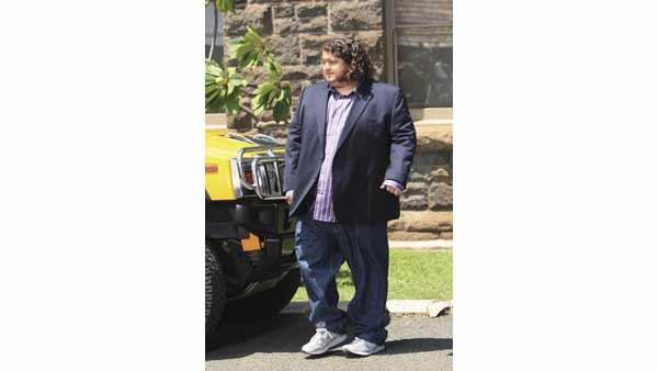 Hurley (Jorge Garcia) stands beside his baller ride.