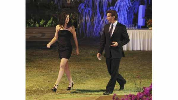 Kate Austen (Evangeline Lilly) is escorted by a spiffy Desmond Hume (Henry Ian Cusick) to her destiny.