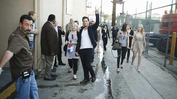 Peter Facinelli (Carlisle Cullen) gives the sign of the best as Dakota Fanning (Jane) walks nearby backstage at the primetime special 'Jimmy Kimmel Live's Twilight Saga: Total Eclipse of the Heart', set to air on Wednesday, June 23 at 10 p.m. ET on ABC.
