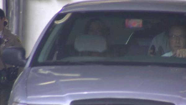 Lindsay Lohan sits in the back of the car that escorted her to the Century Regional Detention Facility in Lynwood where she is set to serve a 90-day sentence for violating the terms of her probation.