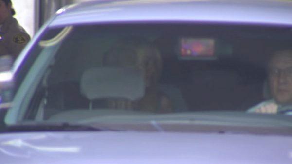 Lindsay Lohan sits in the back of the car that escorted her to the Century Regional Detention Facility in Lynwood where she is set to serve a 90-day sentence for violating the terms of her probation.