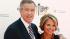 Event co-hosts Brian Williams, left, and Katie...