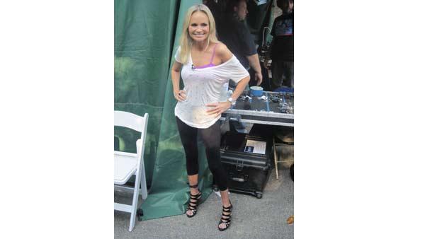 Actress Kristin Chenoweth smiles for photos before appearing on 'Live With Regis and Kelly.'