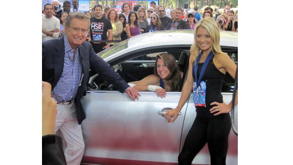 Regis and Kelly pose with High Heel-a-thon winner Ida Bernstein, who totaled her car earlier in the week and dove across the finish line to win the title. She suffered several cuts and bruises during the tumble, but said it was all worth it.