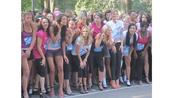 Kelly Ripa listens for pre-race instructions before the starting horn goes off.