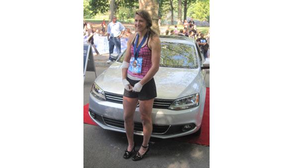 High Heel-a-thon winner Ida Bernstein poses with her new car.
