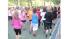 Hundreds of women in heels lumbered toward the...