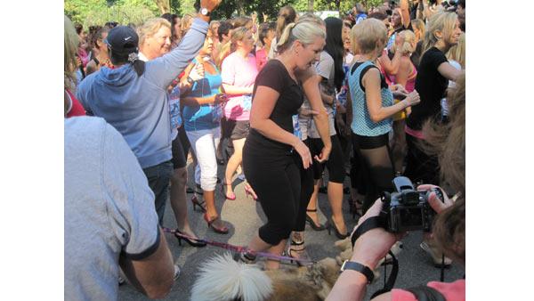 Racer relax after crossing the finish line at the 2010 High Heel-a-thon.