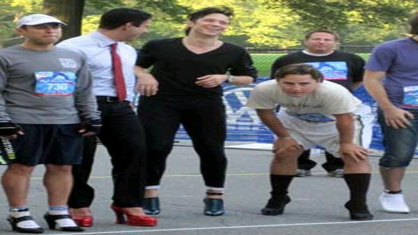 Figure skater Johnny Weir waits for the start of the men's race at the 2010 High Heel-a-thon.