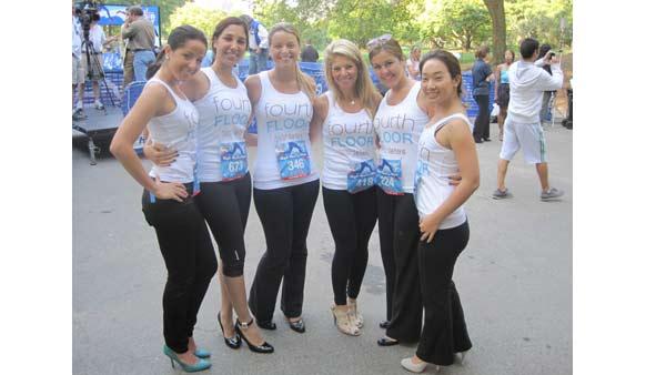 The women of Fourth Floor Fashion pose before the race.