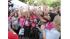 A group of pink-clad racers pose before the High...