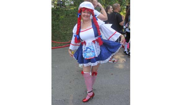 A racer in costume poses before the High Heel-a-thon in Central Park.