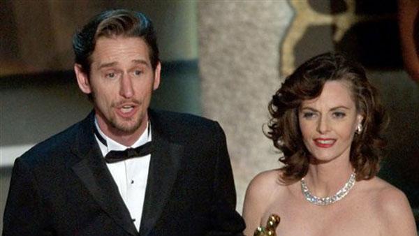 In a March 24, 2002 file photo, Ray McKinnon, center, and Lisa Blount, accept their Oscars for best live action short film for 