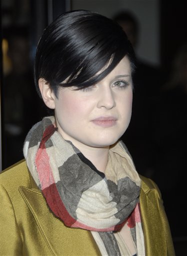 Singer Kelly Osbourne poses on the press line at...