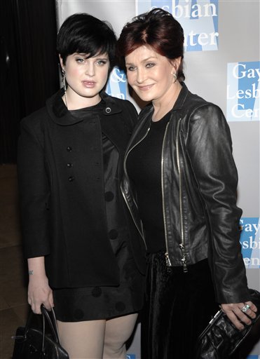 Kelly Osbourne, left, and Sharon Osbourne arrive...