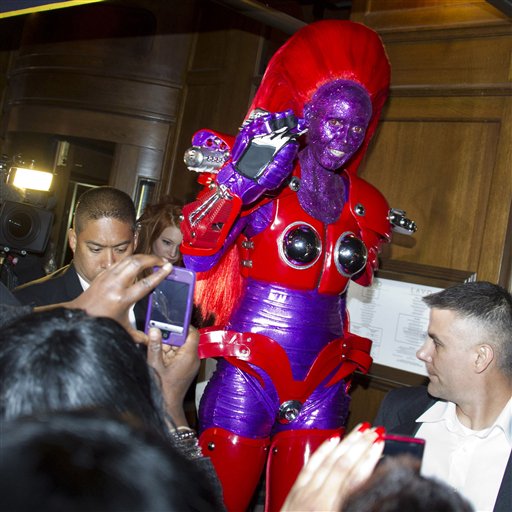 Heidi Klum, dressed in an eight-foot-tall...