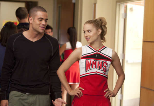 Puck (Mark Salling, L) tries to get Quinn's...