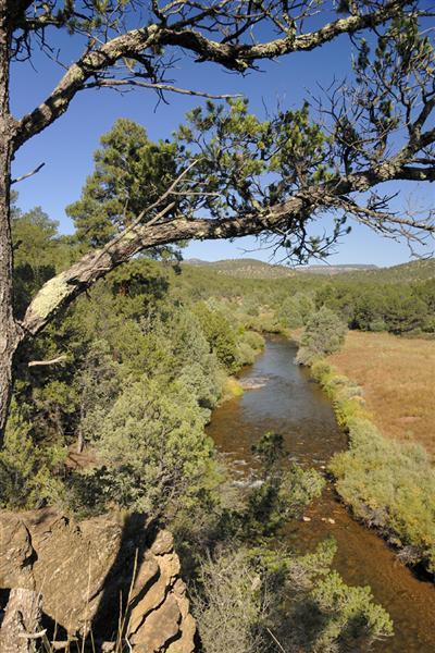 Val Kilmer's New Mexico Ranch. It contains a main log house and a guest house with seven bedrooms and 11 bathrooms in total. The property is as of December 2010 on sale for $18.5 million - down from $33 million in 2009.