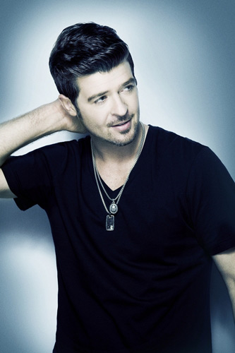 Singer Robin Thicke and his wife, actress Paula...