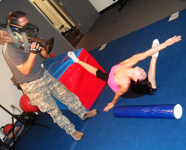 Olga, one of the IRIS performers, stretches...