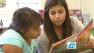 ABC7 Cook Kid Lauren Swerdloff helps a child read in this photo.