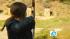 Indoor skydiving, archery, LA Zoo LAIR :: A girl takes aim at a target at the Pasadena Roving Archers archery club in Pasadena.