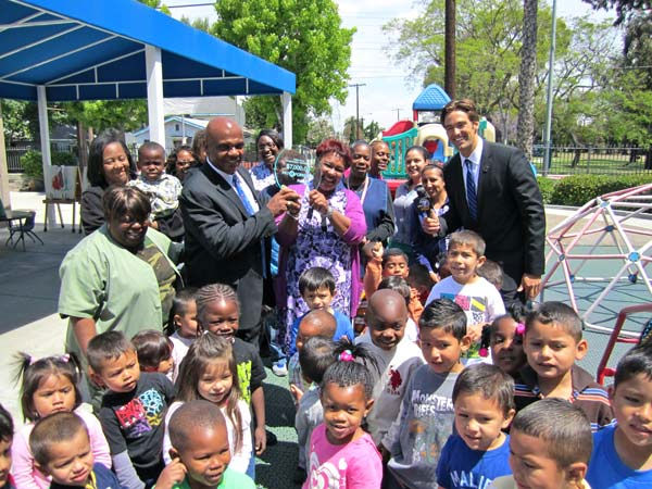 Officials and kids at the Drew Childhood...