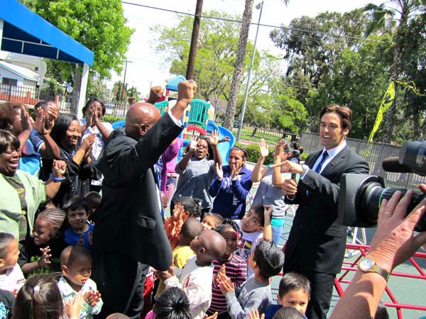 Officials and kids at the Drew Childhood...