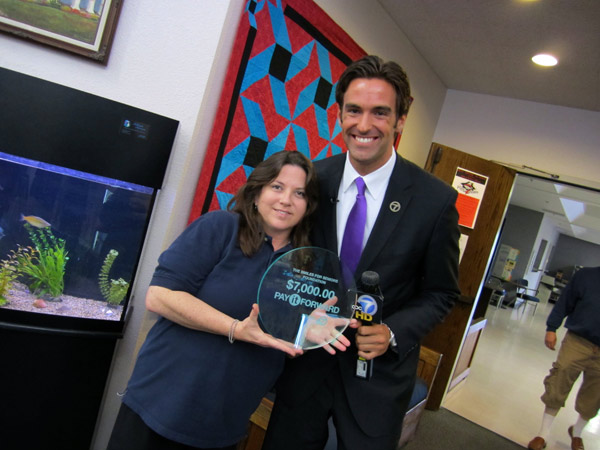 Kathy Serianni and ABC7's Elex Michaelson pose...
