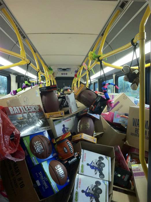 Footballs and other toys are seen on a bus at...