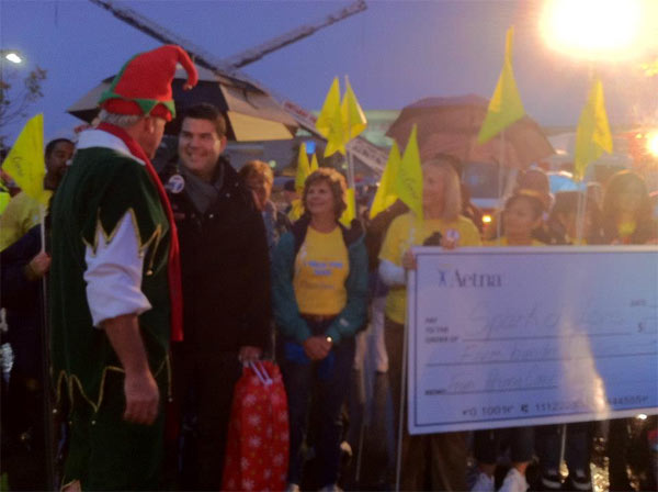 Aetna donates at the Spark of Love Toy Drive in...