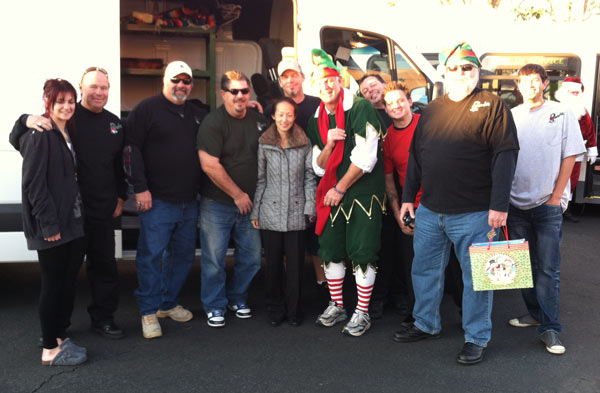 Garth the Elf poses with a group at the...