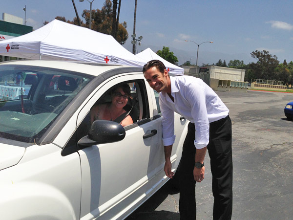 ABC7 Reporter Elex Michaelson greets a donor at...