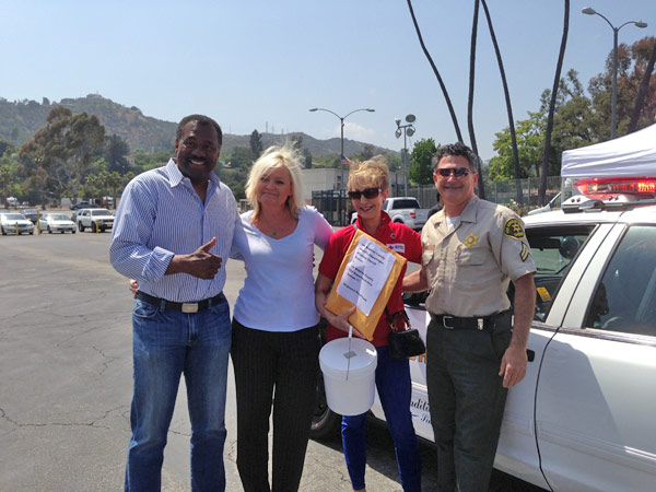 ABC7 Anchor Marc Brown poses with American Red...